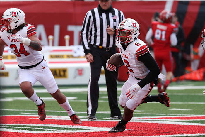 Apr 23, 2022; Salt Lake City, Utah, USA; Utah Utes redshirt freshman cornerback Kenzel Lawler (2) runs with the ball after intercepting the pass in the first quarter at Rice Eccles Stadium. Mandatory Credit: Rob Gray-USA TODAY Sports
